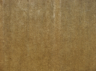 Fototapeta na wymiar brown stone cut wall with some wear