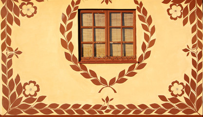 Wall of a hut decorated with traditional African motifs