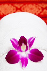 Fototapeta na wymiar White towel and flower