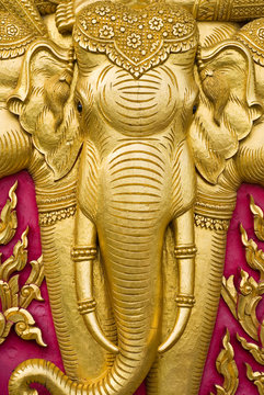 elephant carved gold paint on church door