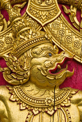 Fototapeta na wymiar garuda carved gold paint on church door