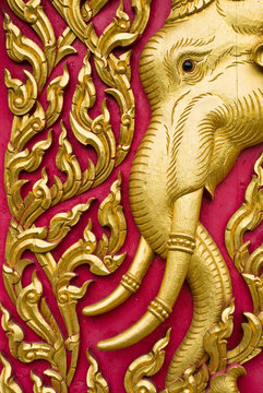 elephant carved gold paint on church door
