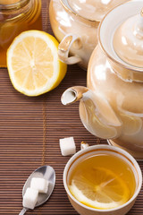tea, pot and honey on table