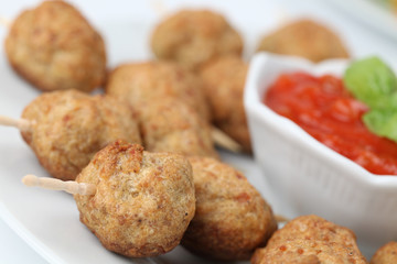 Kebab with tomato sauce