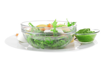 salad with smoked salmon in transparent bowl