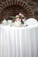 serving on the background of a brick wall