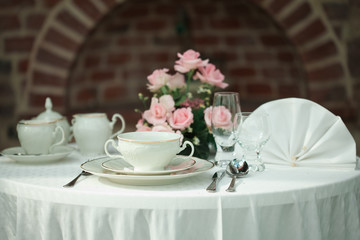 serving on the background of a brick wall