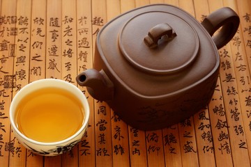 Traditional chinese tea on bamboo books