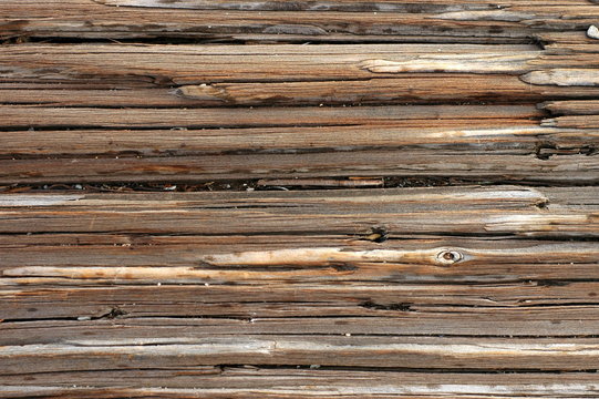 Abstract background texture of weathered, cracked wood