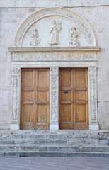 Fototapeta na wymiar Wooden doors. St. Francesco Basilica. Assisi. Umbria.