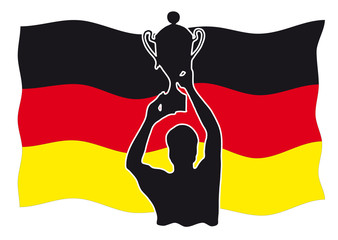 Sieger mit Pokal vor deutscher Flagge