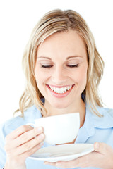 Glowing businesswoman holding a cup of coffee