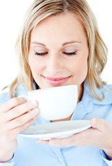 Happy businesswoman holding a drinking cup isolated