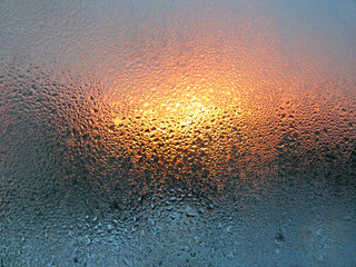 water drop and sunlight on glass