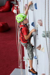Boy on climbing wall