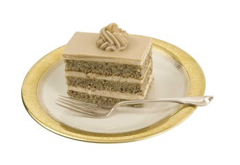 fresh slice of hazelnut cake on a ornate plate