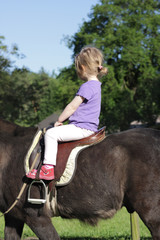 little girl riding