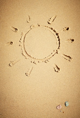 Fototapeta na wymiar Sun drawn on sand