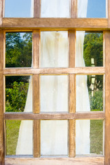Old wooden windows with drape