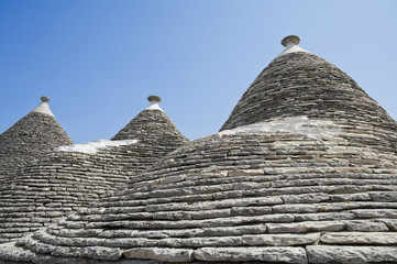 Fototapeta na wymiar Trulli. Conical roofs. Alberobello. Apulia.