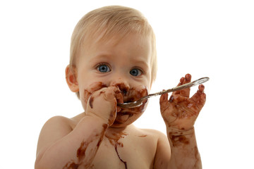 bébé gourmand, en train de manger du chocolat