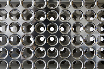 Perforated chrome - background from laboratory