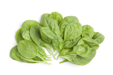 Fresh green spinach leaves on white background