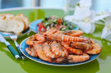 dish served with a lot of fried tiger prawns on the table