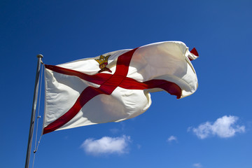 Jersey flag against blue sky