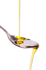 olive oil poured into spoon
