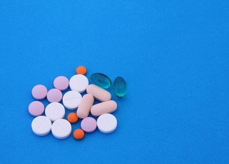 Pills over blue background
