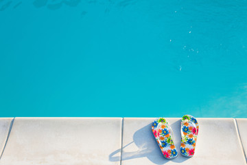 flip-flops near the swimming-pool