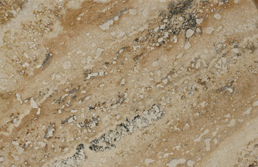 Surface of the travertine. Tints of brown and beige. Mottled pat