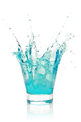 Fototapeta na wymiar Glass with splashing blue drink