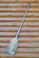 Old wooden baker's shovel on wall