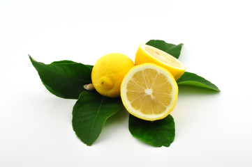 three lemons with leaves and blossom