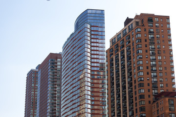 Fototapeta na wymiar facade of modern apartment building with reflection of blue sky