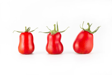 Three red ripe roma tomatoes