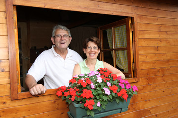 Senior couple in log cabin