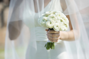 Bride holding beautiful wedding flowers bouquet