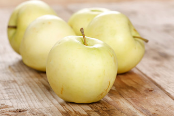 organic apples on the wood board