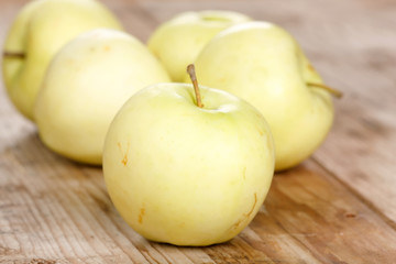 organic apples on the wood board