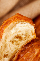 piece of croissant pastry, extremely closeup