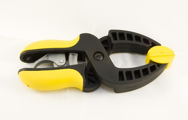 Photo of a closed clamp on white background