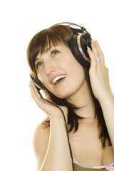 Fototapeta premium Woman listening to music and singing