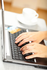 Woman's hands and laptop