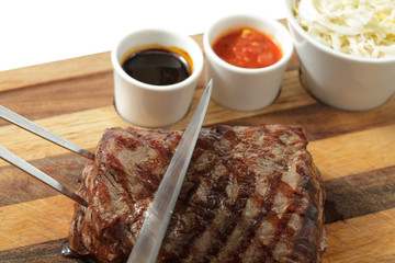 roasted meat on a cutting board. isolated object