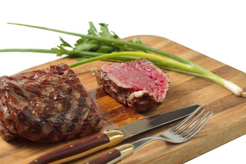 roasted meat on a cutting board. isolated object