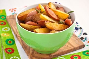 fried potatoes with sausage and rosemary