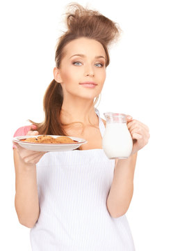 housewife with milk and cookies